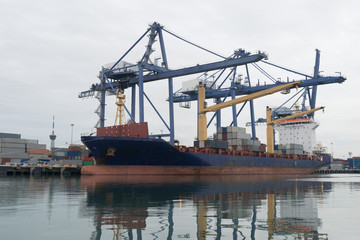 Container ship in asia port while load the job