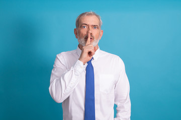 isolated businessman with expression of silence or shut up