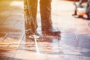 Outdoor floor cleaning with high pressure water jet