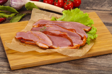 Sliced smoked duck breast served salad