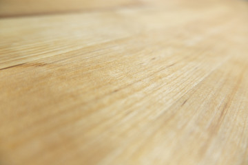 Wood texture, wooden background in perspective closeup with shallow depth of field.