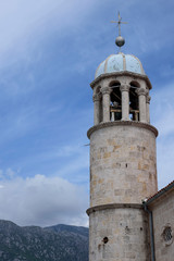 Fototapeta premium Tower of the Church of Our Lady of the Rock on the island of the same name, in the Bay of Kotor in the Adriatic, Montenegro, Europe.