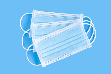 Medical mask isolated on blue background for protect air polution or virus covid 19, health care...