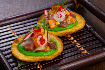 Taco with tuna and salmon