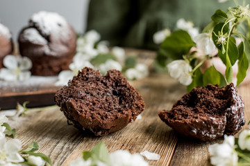 Delicious chocolate cupcakes on a wooden table