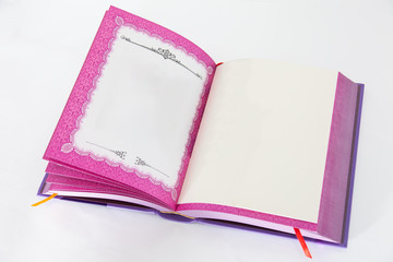 Isolated open book with pink decoration