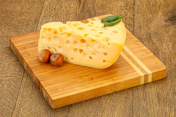 Maasdam cheese - yellow triangle with holes