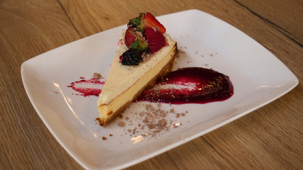 Cheesecake in glass with fresh raspberries and cream cheese. Healthy homemade organic dessert.