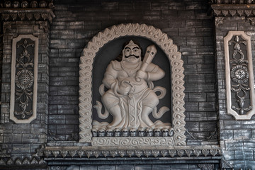 Details of a statue or wall carvings in Chinese Buddhist temple