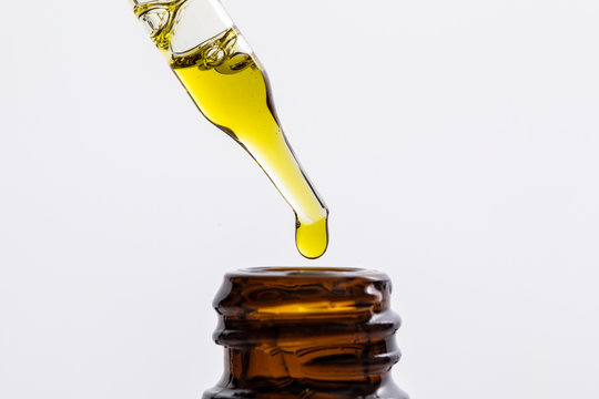 Close up of CBD oil in a dropper bottle