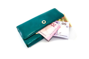 Ukrainian hryvnia in a women's wallet on a white background. Close-up.