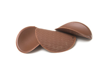 Closeup of chocolate in shaped tiles on white background