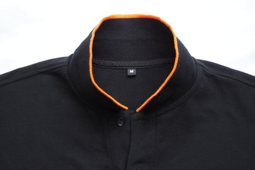 Top view of beautiful and casual black polo shirt with size label inside and good quality of seam and stitch on white background for new design pattern of apparel product for advertising