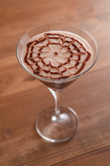 Cocktail in a bar on wooden table.