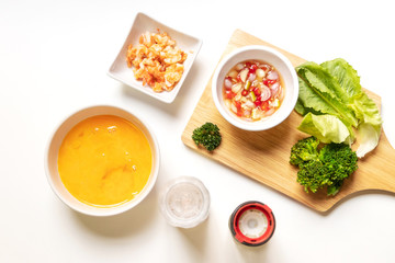 Omelette ingredients for creamy omelette with shrimps on rice served fish sauce with Thai chilis (Thai condiment “Prik Nam Pla”). Delicious and easy menu.  