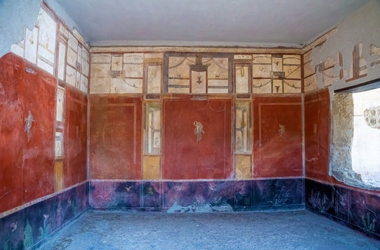 Roman frescoes in the ancient ruins of the City of Pompei, Naples, Italy