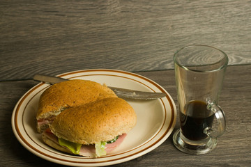 Ham salad sandwich and pot of coffee