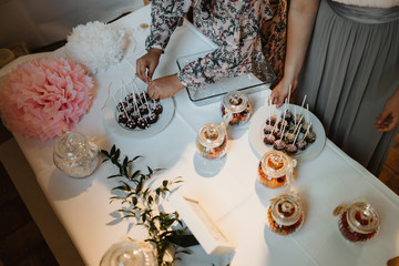 photo of people around a candy bar table