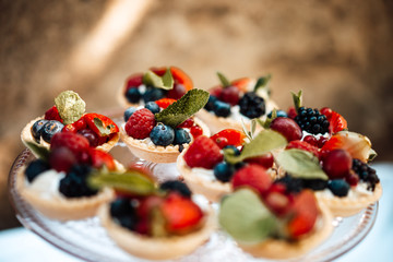 photo of small berries tartelette in a plate