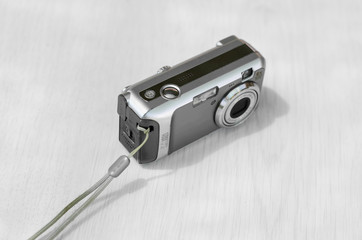 Old digital camera. The small camera is silver.