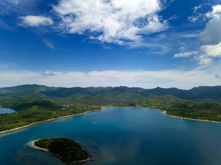 Lombok, Indonesia, south Gili islands. Aerial drone view from the Gili Asahan island  to the sea and the highlands of Lombok.