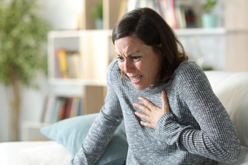 Adult woman suffering heart attack at home