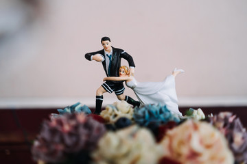 photo of a wedding cake cartoon topper