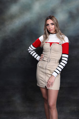 Beautiful, glamourous blonde girl posing in studio on isolated background. Style, trends, fashion...