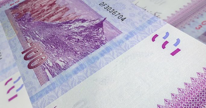 Detailed macro capture of brand new RM 100 with sequential number. Macro shot from the back of Malaysian money with the picture of Mount Kinabalu. 3d effect footage over one hundred Ringgit Malaysia. 