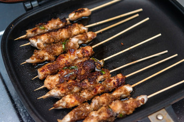 Chicken skewers or meat on the grill Indonesian food satay