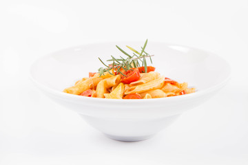 Penne with tomatoes, garlic and mozzarella decorated with rosemary twig, on a white background