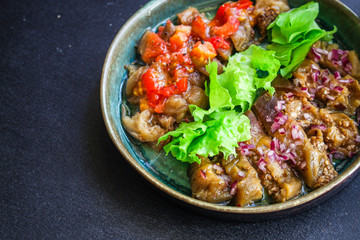 eggplant salad spices and tomatoes, antipasto Menu concept healthy eating. food background top view copy space for text keto or paleo organic product diet
healthy eating