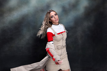 Beautiful, glamourous blonde girl posing in studio on isolated background. Style, trends, fashion...