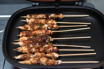 Chicken skewers or meat on the grill Indonesian food satay