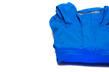Folded blue zipper windbreaker jacket, rain proof and waterproof hiking Gore-Tex jacket hoodie....