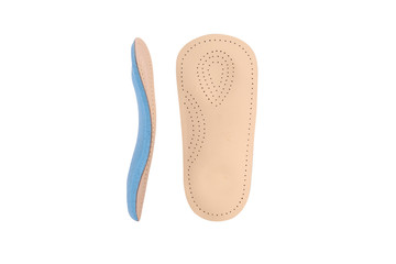 Isolated orthopedic insole on a white background. Treatment and prevention of flat feet and foot diseases. Foot care, comfort for the feet. Wear comfortable shoes. Medical insoles. Flat Feet Correctio