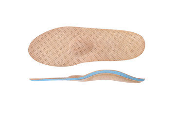 Isolated orthopedic insole on a white background. Treatment and prevention of flat feet and foot diseases. Foot care, comfort for the feet. Wear comfortable shoes. Medical insoles. Flat Feet Correctio