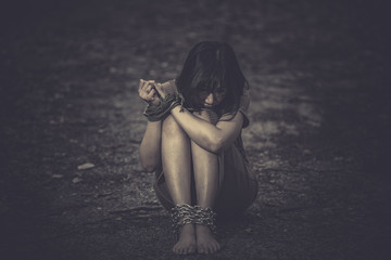 Asian hostage woman Bound with rope at night scene,The thieves kidnapped for ransom,thailand people