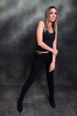 Beautiful, glamourous blonde girl posing in studio on isolated background. Style, trends, fashion...
