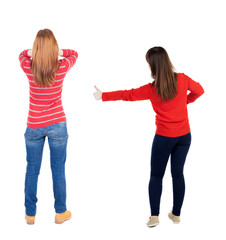 Back view of couple in sweater showing thumbs up.