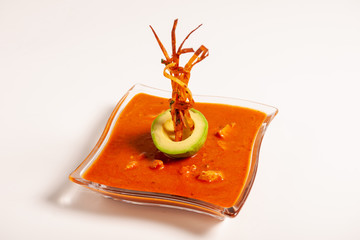 Seasoned Tomato Soup with avocado and decorations