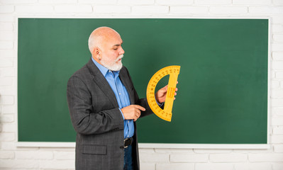 Man bearded tutor in classroom. Mature pedagogue share his knowledge. Stem knowledge is in demand...