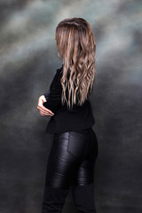 Beautiful, glamourous blonde girl posing in studio on isolated background. Style, trends, fashion...