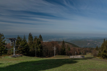 Ski slope with ski tow near Radhost hill in spring sunny day