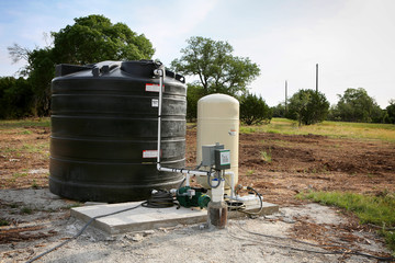 Deep water well set up, country side construction. Drilled draw well with pressure switch and...