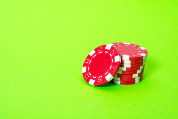 Casino chips on green background isolated