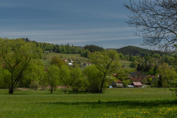 Fototapeta na wymiar Dolni Becva village in spring color fresh green day with church and meadows