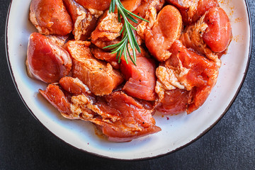raw meat pork or beef in a plate on the table (preparing healthy food, marinade and spices paprika) menu concept background. top view. copy space for text