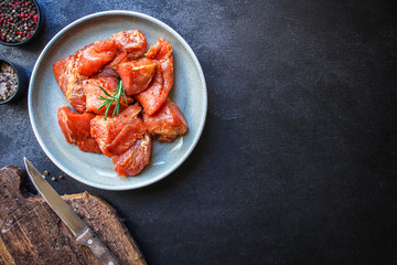 raw meat pork or beef in a plate on the table (preparing healthy food, marinade and spices paprika) menu concept background. top view. copy space for text