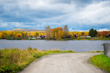 Fototapeta na wymiar Autumn foliage, rural area in the Urals, autumn landscape, Russia